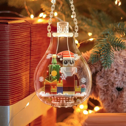 Boule de Noël lumineuse transparente avec figurine Père Noël en briques