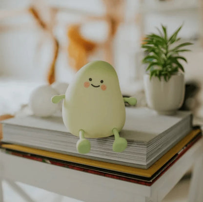 Veilleuse LumiBuddy Mangue silicone jaune-vert souriant fond rose nuages — Mon Univers - Mes Lumières